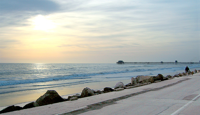 Even cloudy days are beautiful in Oceanside. As sunset nears, this view from Aurora's front window shows historic Oceanside Pier, just a short walk from home via beach or strand.